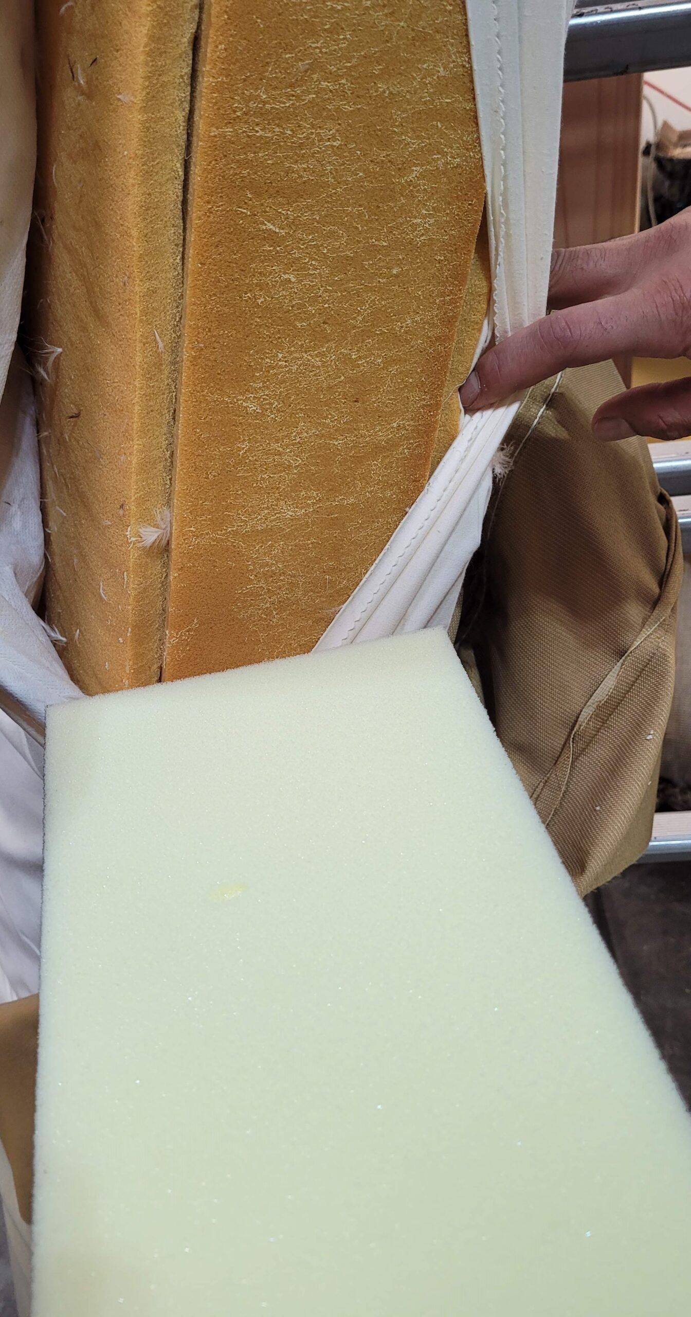Old and new foam layers side by side inside a cushion cover