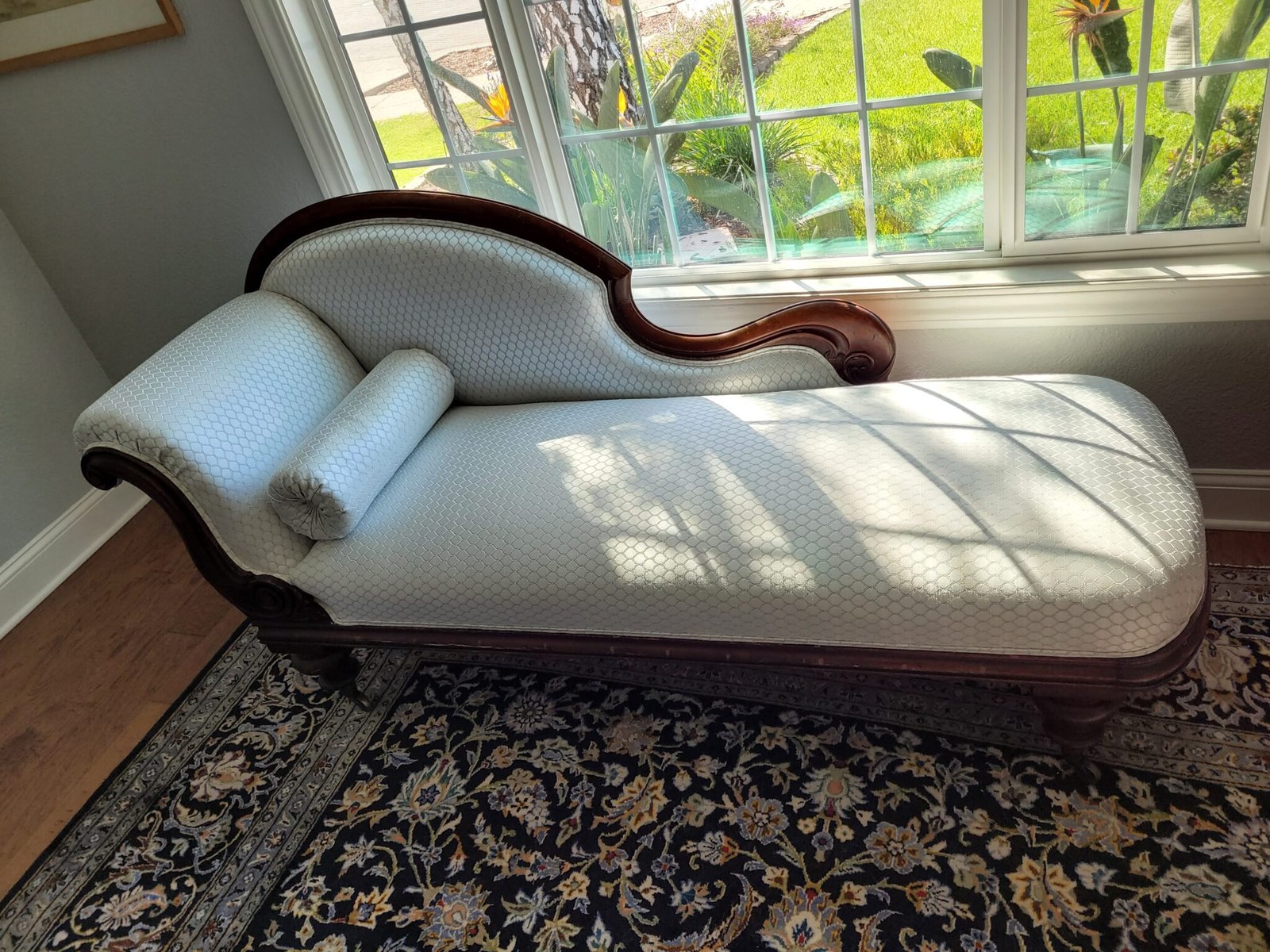 Antique fainting couch with carved walnut frame, reupholstered in pale blue damask